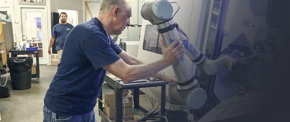 Man programming collaborative robot