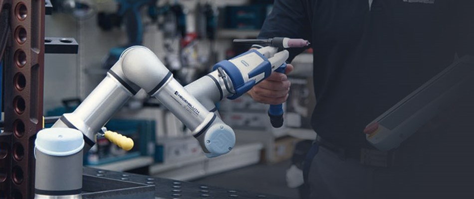 Man programming collaborative robot