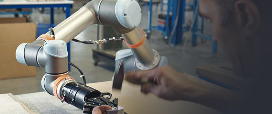 Man programming collaborative robot