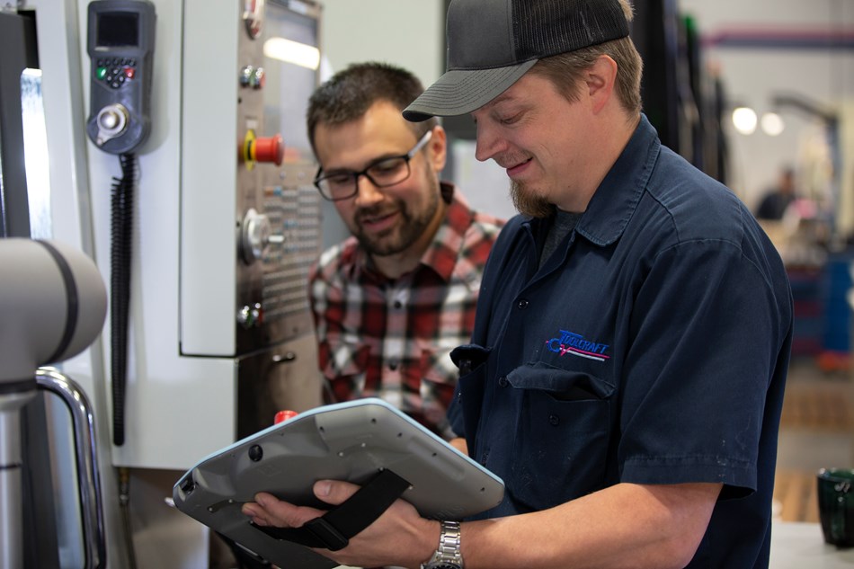 After Troy Ojalehto (left) at Rapid Design Solutions, a Certified Systems Integrator of Universal Robots, developed the initial application, Toolcraft’s automation engineer, Brian Laulainen (right), was able to handle the daily operation in addition to developing a parts rinsing and drying station as an application add-on for the UR5e. Laulainen did the training through the UR Academy, then supplemented with a few hours hands-on training with Ojalehto.