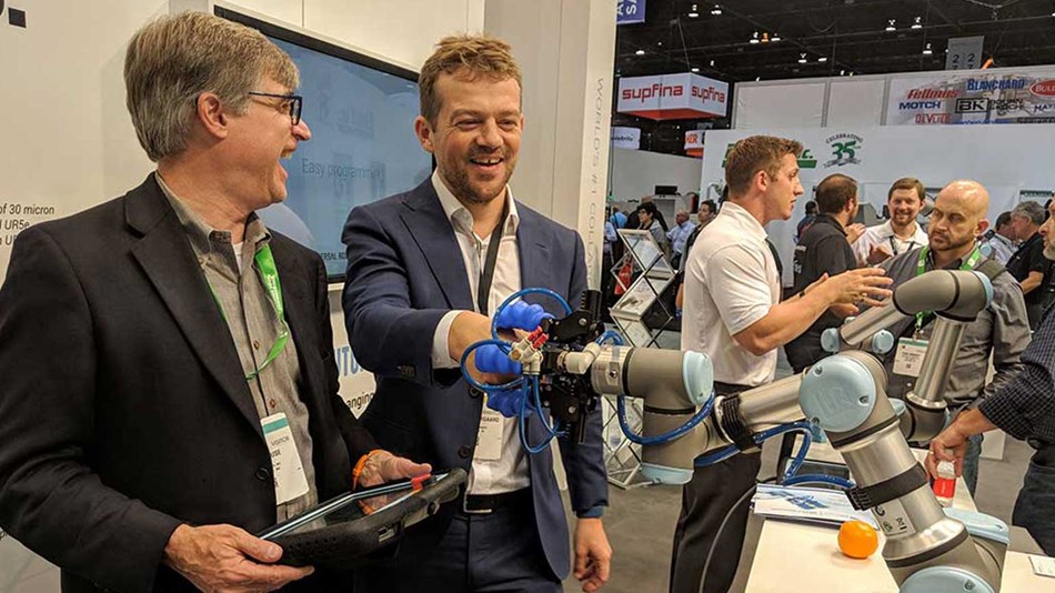 Partner handshake: CEO of Soft Robotics Carl Vause (left) demonstrates his company’s new UR+ certified gripper to Universal Robots’ founder Esben Østergaard.